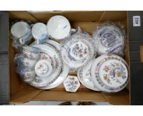 A collection of Wedgwood Kutani Crane patterned items to include ginger jars, cups, saucers, serving platters, etc. 