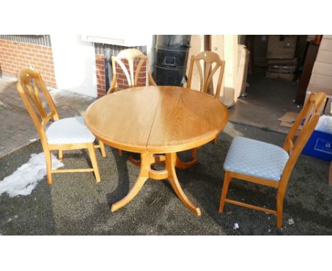 Ercol Light oak extending dining table with four matching chairs (5)