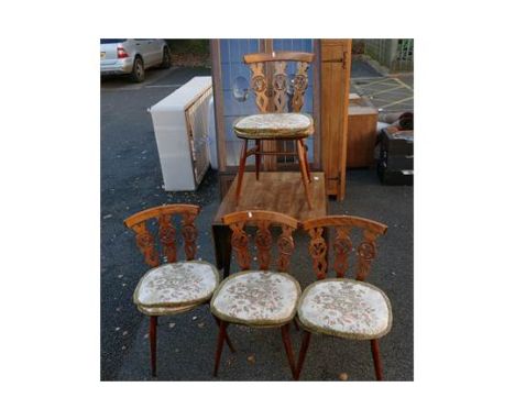 A mid century Ercol dining set to include drop leaf table with four Ercol dining chairs in the Fleur de Lis design with origi