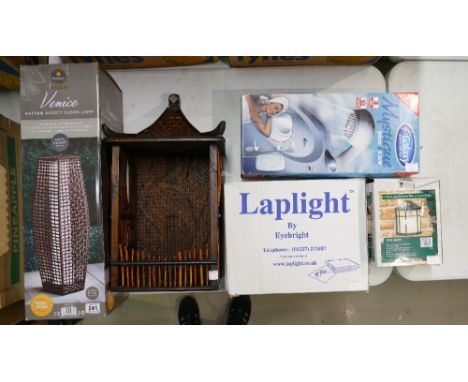 A mixed collection of items to include boxed rattan effect floor lamp, similar book shelf, boxed Galaxy branded shower, etc. 