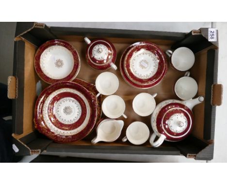 A mixed collection of  Meakin tea and dinner ware with burgandy and gilt decoration in the Sol design to include cups, saucer