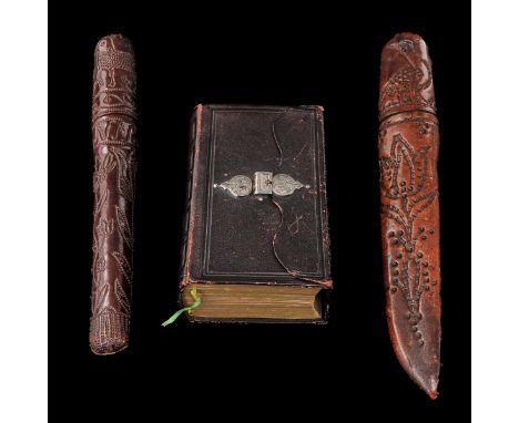 consisting of a Bible with silver clasp and 2 scabbards including leather dated 1762 length 25 cm.