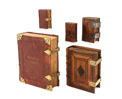 consisting of 5 Bibles, including with silver and gold clasps, largest 30 x 38 x 10 cm.