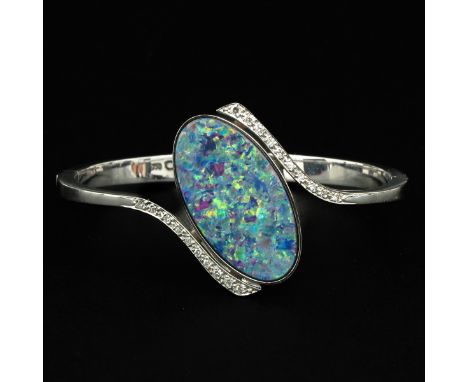 18KG set with 20 diamonds and large opal 16 x 30 mm.