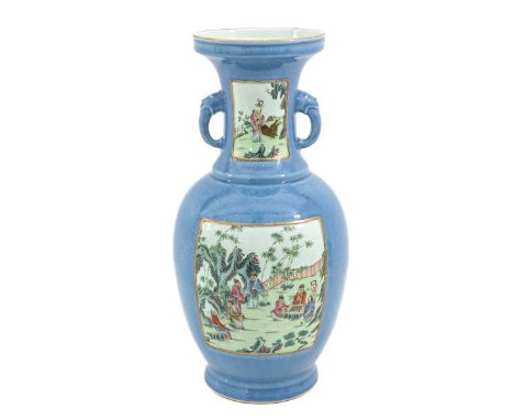 Light blue ground with scenes depicting gathering of Chinese figures in garden in Famille Rose enamels, Qianlong mark, 62 cm.
