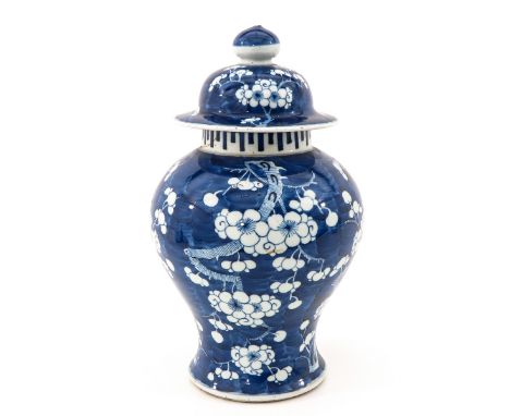 Dark blue ground decorated with white flower blossoms, marked with double ring, 38 cm. tall, restored.
