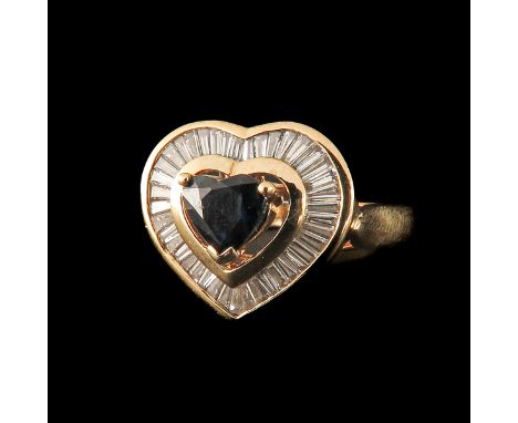Set with a heart-shaped cut ruby and many baguette cut diamonds ring size 17