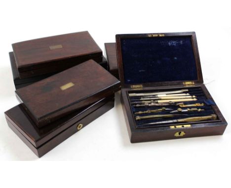 Six drawing / compass sets, each in rosewood box, containing numerous compasses
