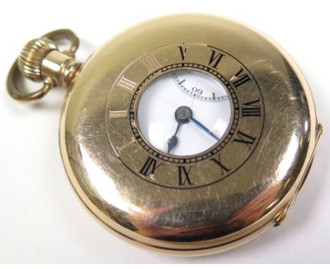 Gold plated half hunter pocket watch. The white enamel dial applied with black Arabic numerals, bordered by a minute track, s