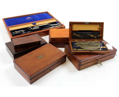 Eight drawing / compass sets, each in mahogany box, containing numerous compasses