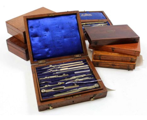 Eight drawing / compass sets, each in mahogany box, containing numerous compasses