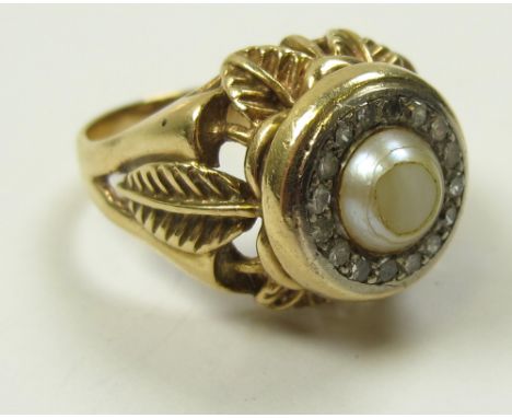 18ct Gold ring set with central pearl surrounded by Diamonds size Q weight 11 grams 