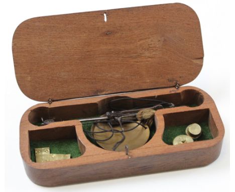 Coin scales. A set of coin scales, circa early 19th century, with four weights, all contained in original mahogany box