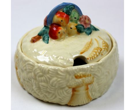 Clarice Cliff lidded butter dish in the celtic pattern. Marked Clarice Cliff Newport to the base. Measures 10cm across. 