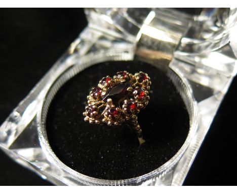 9ct Gold Ring set with Marquise and round Garnets size J weight 4.1 grams