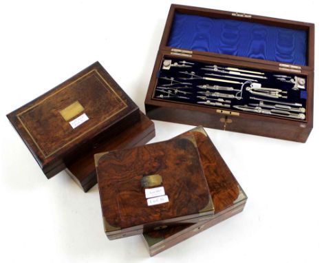 Five drawing sets, each in walnut box, containing numerous compass