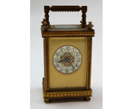 Five glass brass carriage clock with black Arabic numerals on a silver face approx height not including handle 11.5cm (key in