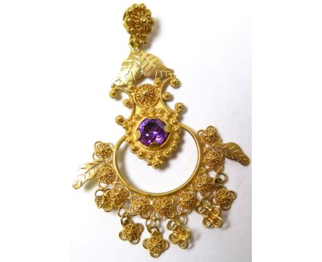 Yellow Metal Indian style Drop pendant set with central Amethyst (tests as 18ct) weight 11.8 grams 