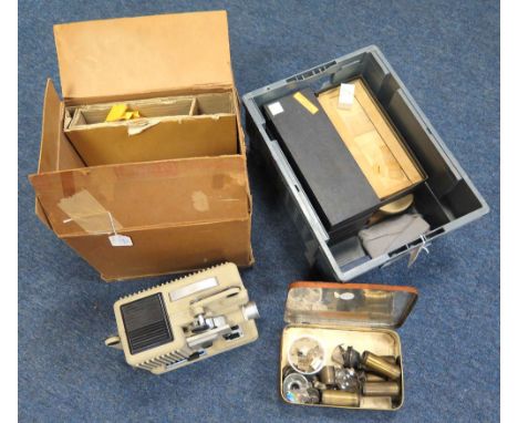 Eumig P8 automatic projector, in original packaging, together with five small cases of microscope slides, plus a tin of lense