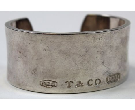 Tiffany & Co., heavy silver bangle dated 1997, stamped to both sides. Approx. 110g.