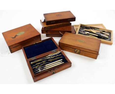 Eight drawing / compass sets, each in mahogany box, containing numerous compasses