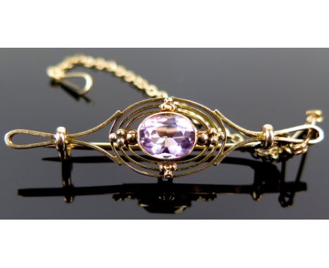 Yellow metal bar brooch set with Amethyst with safety chain weight 3.6 grams