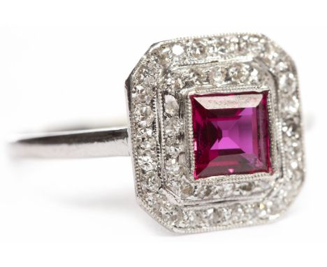 ART DECO RUBY AND DIAMOND RINGset with a central square step cut ruby surrounded by two rows of old round brilliant cut diamo