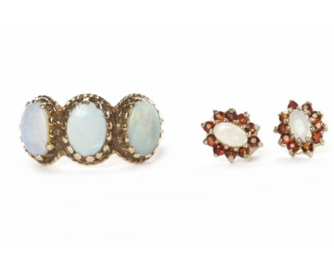 OPAL DOUBLET SET RINGwith three oval opal doublets in nine carat gold, size O; along with a pair of opal doublet and gem set 