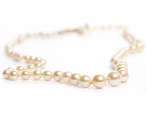 TWENTIETH CENTURY PEARL NECKLACEformed by graduated pearls, approximately 50cm long, the clasp pin marked for eighteen carat 
