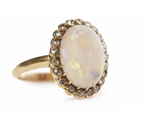 EARLY TWENTIETH CENTURY OPAL AND DIAMOND CLUSTER RINGthe oval opal 13mm long and surrounded by rose cut diamonds, unmarked, s