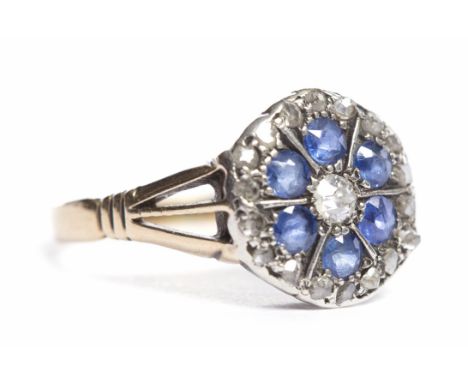 ART DECO STYLE SAPPHIRE AND DIAMOND RINGthe central diamond surrounded by sapphires in a floral design, in turn surrounded by