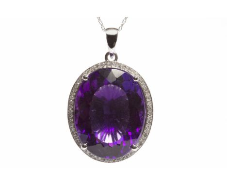 IMPRESSIVE AMETHYST SET PENDANTset with a single large oval amethyst of approximately 21.00 carats, in a diamond setting, in 