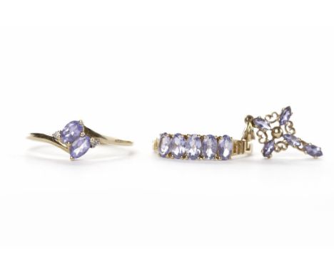 TANZANITE DRESS RINGset with three rows of round tanzanites, in nine carat gold, size O; along with a similar pendant also in