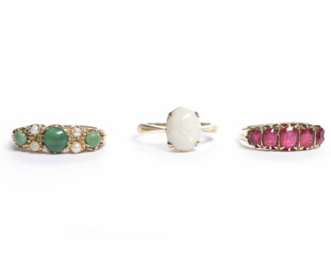 THREE GOLD DRESS RINGScomprising an opal ring, stamped PPLD 9ct, size L; a ruby five stone ring, marked for eighteen carat go