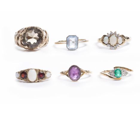 GROUP OF GOLD RINGSincluding an amethyst set example and an opal example, all in nine carat gold (6)