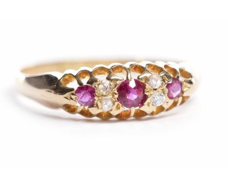 VICTORIAN RUBY AND DIAMOND RINGthe stones set in a boat shaped bezel, in eighteen carat gold