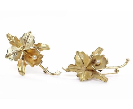 TWO EIGHTEEN CARAT GOLD ORCHID MOTIF BROOCHESeach set with a single pearl, each approximately 55cm long, 14g gross