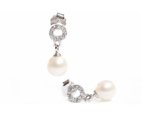PAIR OF WHITE GOLD PEARL DROP EARRINGSeach with a single white spherical pearl 7mm diameter, suspended from a white gem set o