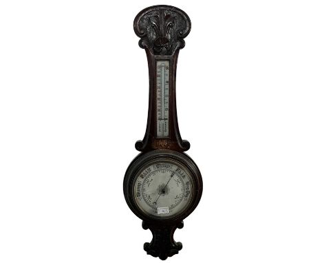 VICTORIAN ANEROID BAROMETER WITH THERMOMETER, AND A WALL MIRROR  the barometer in an oak case, the mirror with bevelled glass