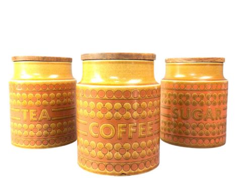 THREE HORNSEA KITCHEN STORAGE JARS, SAFFRON PATTERN the pottery jars each with a wood lid, the bodies marked Tea, Coffee and 