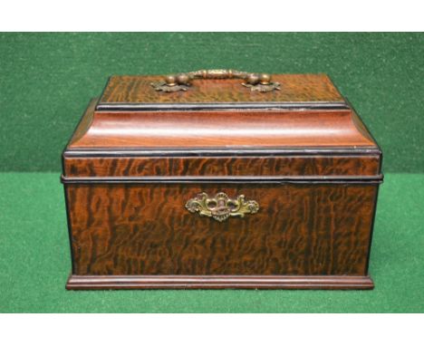 Partridge wood tea caddy, the lid having brass handle opening to reveal four section interior and standing on a moulded plint