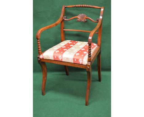 Open elbow chair having bobbin and turned top rail with carved back rail leading to sweeping arms supported by bobbin upright