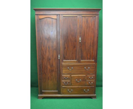 Mahogany compactum wardrobe having single full length left hand door enclosing hanging space and a pair of right hand panelle