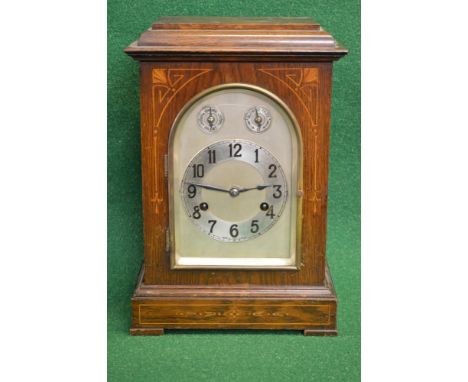 Oak cased inlaid 8 day mantle clock having silvered dial with black numbers and black hands