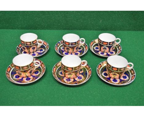 Six Royal Crown Derby Imari style patterned cups and saucers having orange back stamp