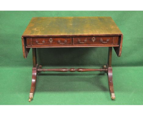 Mahogany sofa table the top having two D shaped drop flaps over two short drawers with brass handles and escutcheons, support