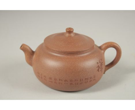 A CHINESE YIXING TEAPOT, with incised calligraphy, impressed marks to inner lid and base.