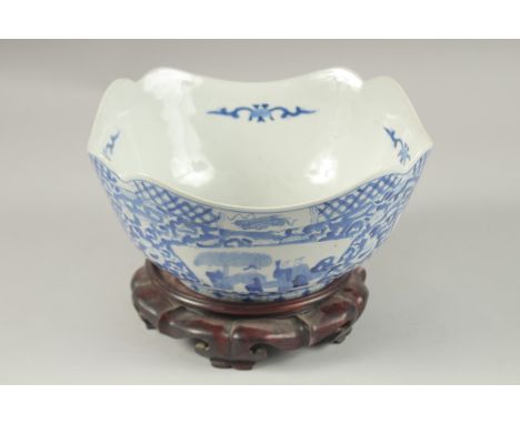 A CHINESE BLUE AND WHITE PORCELAIN SQUARE FORM BOWL AND HARDWOOD STAND, the bowl with panels of figures, base with character 