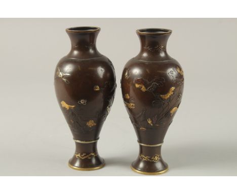 A FINE PAIR OF JAPANESE MEIJI PERIOD MIXED METAL INLAID BRONZE VASES, decorated with gilt and silver cranes and flora, each s