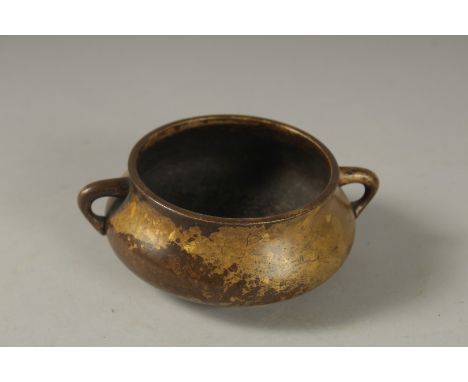 A GOOD SMALL 18TH CENTURY CIRCULAR BRONZE TWIN HANDLE CENSER, Kangxi mark to base, 10cm diameter.